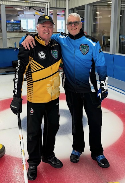 Competitors sharing a hug on the ice